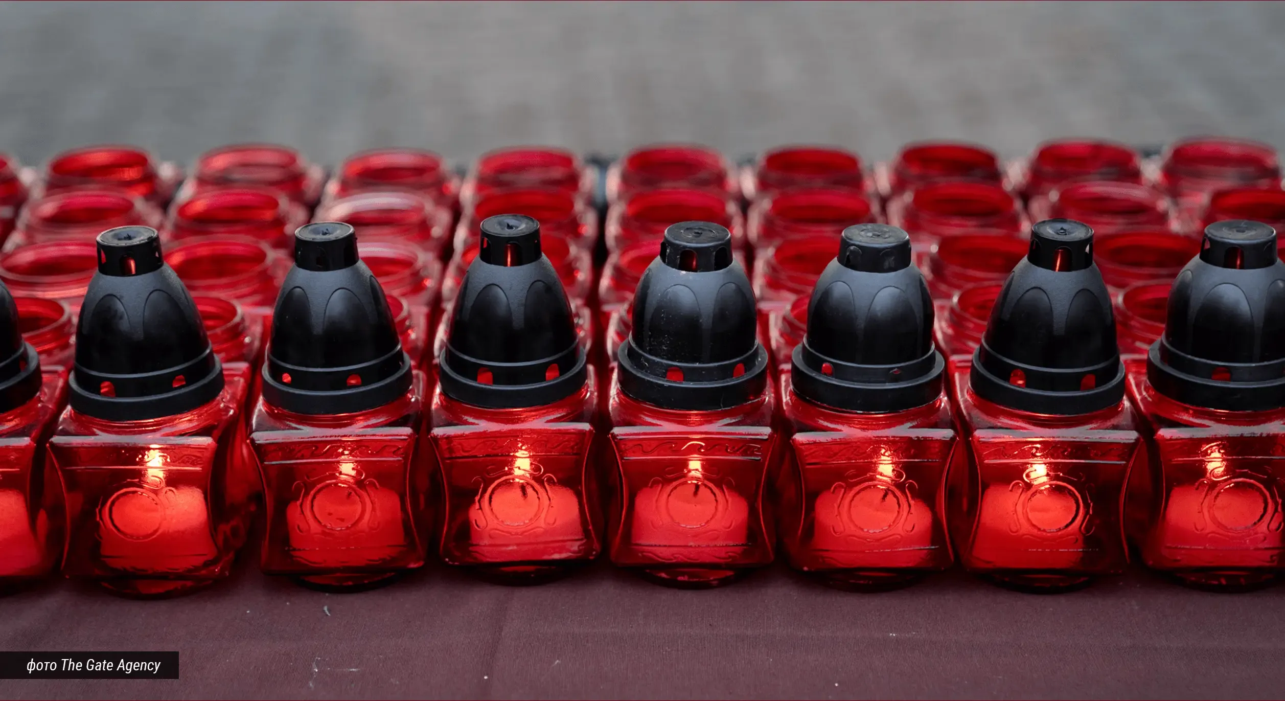Rows of red memorial candles